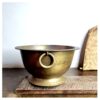 Kaadhu footed Padikkam a smooth pattern ring loop holder golden bronze