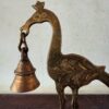 Ornate brass peacock holding the bell decor accent - Image 8