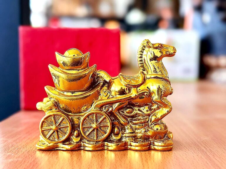 Feng Shui prosperity golden galloping horse with cart filled with golden bowl, gold coins all around