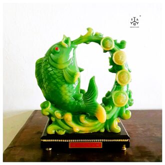 Feng shui Green Carp leaping out of strong current biting on a pearl