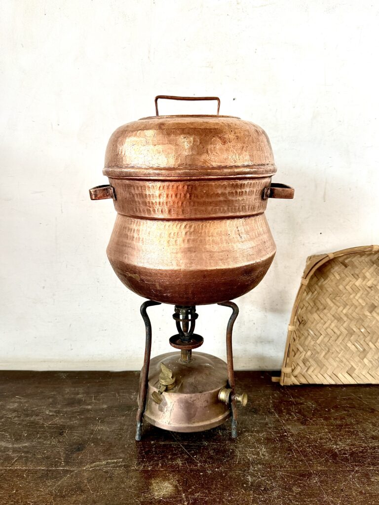 Kerala classic Copper Idly pot with idly steamer plate on top and perforated steamer dish At bottom