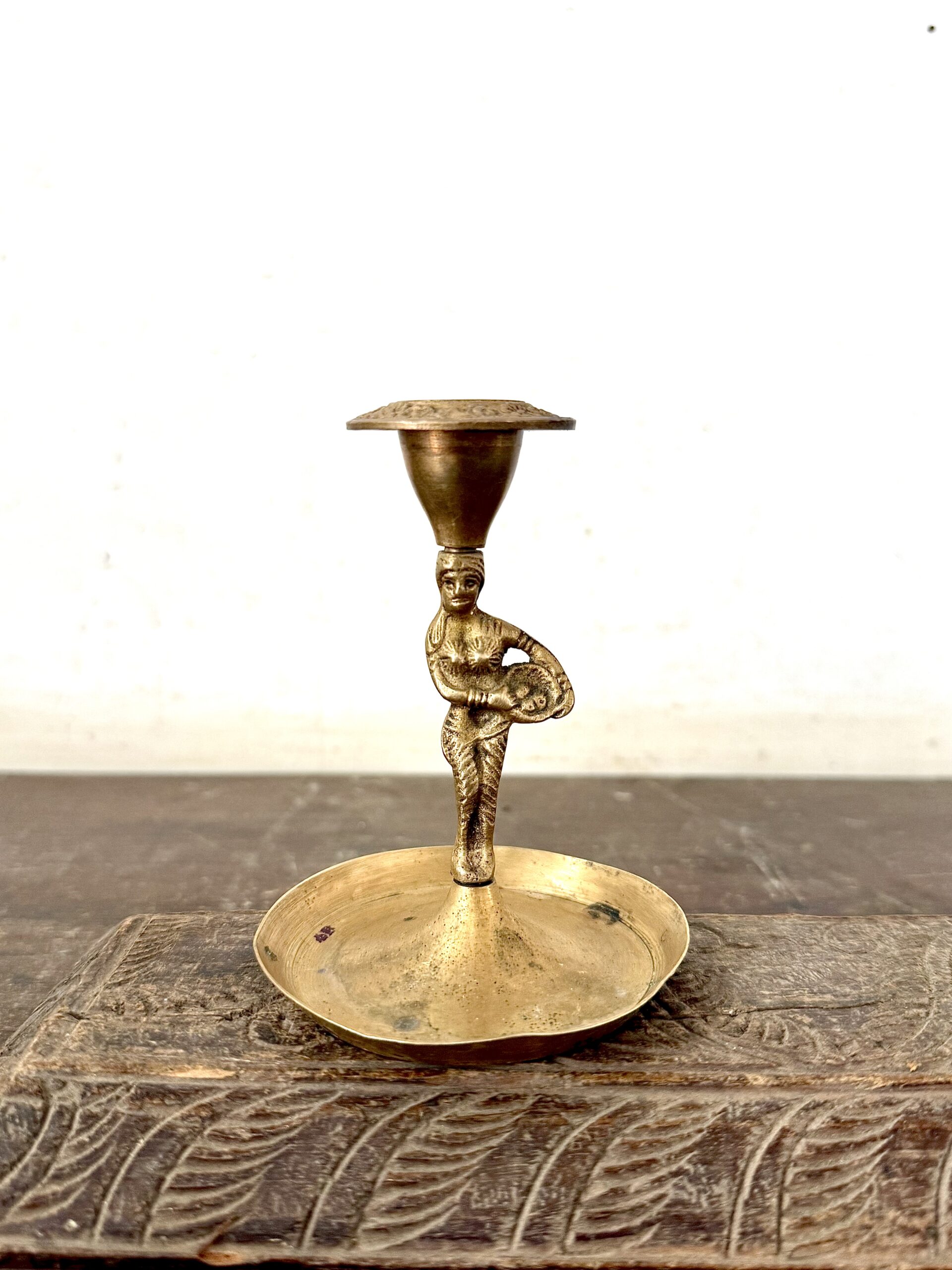 Classic lady with basket brass candle bar from Colonial era