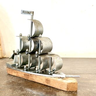 Classic brass sails ship with nickel coat and wood base rest