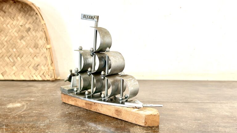 Classic brass sails ship with nickel coat and wood base rest